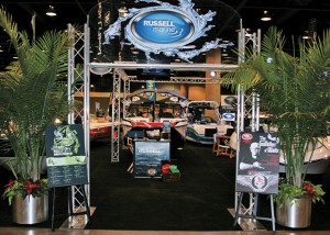 Russell Marine’s goal is to have the best display at each boat show, with a grand  entrance, plush carpets, fresh greenery and more. 
