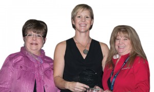 Last year’s winner, Debbie Meigs, with Chupich and Kathy Johnson of Boating Industry. (Photo by Universalimage.net)