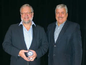 David Rockefeller receiving his award from Dominion senior vice president Ian Atkins.