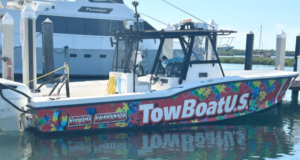 TowBoatUS Autism Awareness boat on the water.